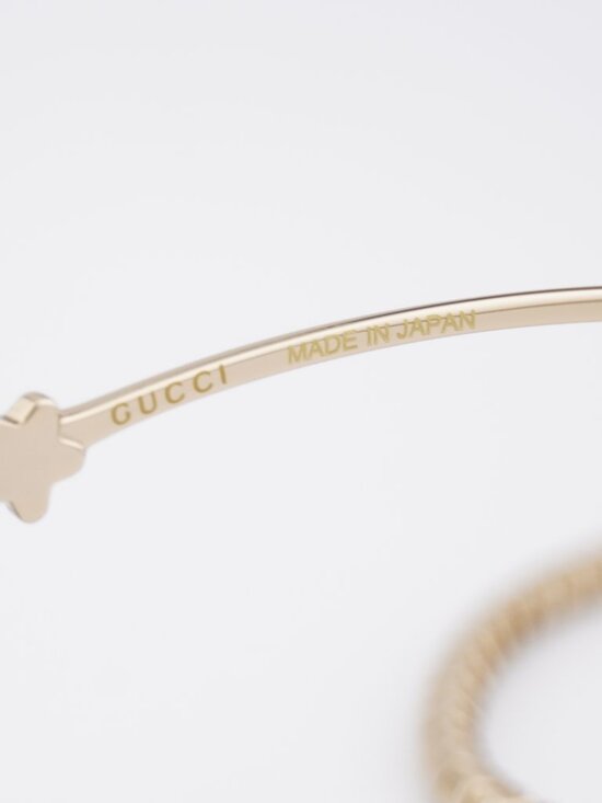 Gucci GG1569S 002 Sunglasses Gold with White Stone Cat Eye Frame, Brown Lenses